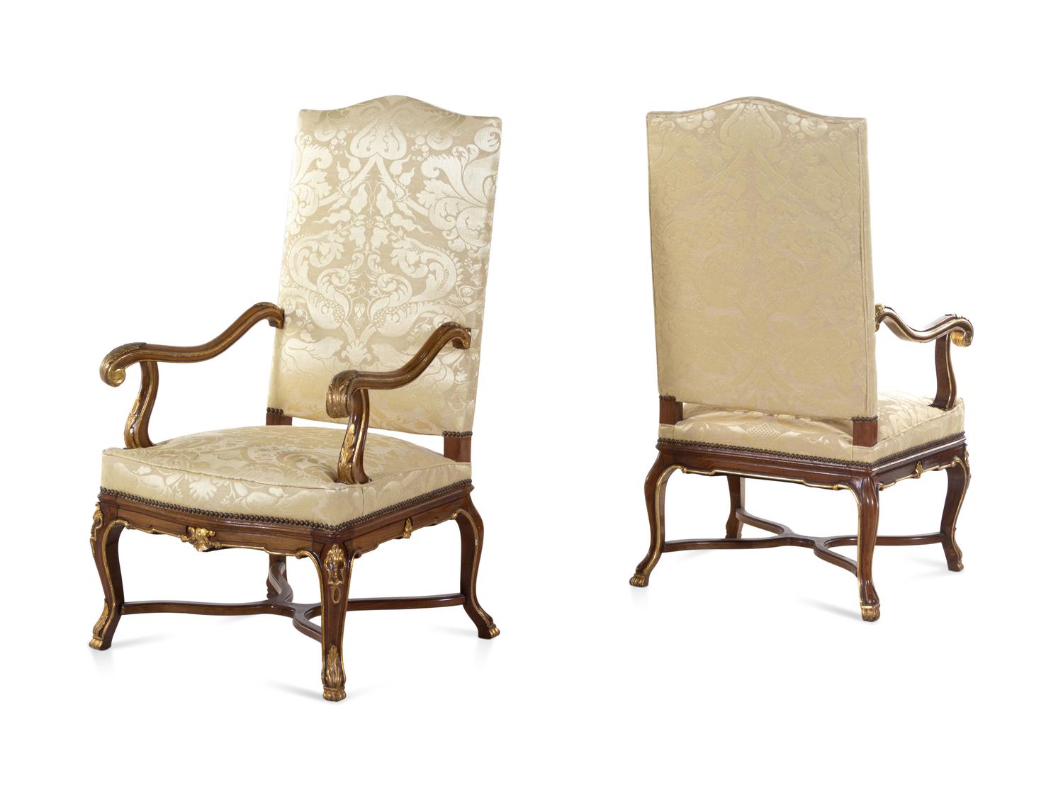 A Pair of Louis XV Style Carved and Parcel Gilt Walnut Fauteuils