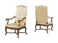 A Pair of Louis XV Style Carved and Parcel Gilt Walnut Fauteuils