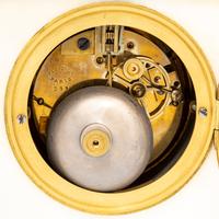 A French Gilt Bronze and Marble Clock