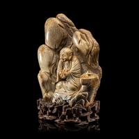 A Chinese Burnt Jade 'Luohan' Boulder 火燒玉羅漢山子