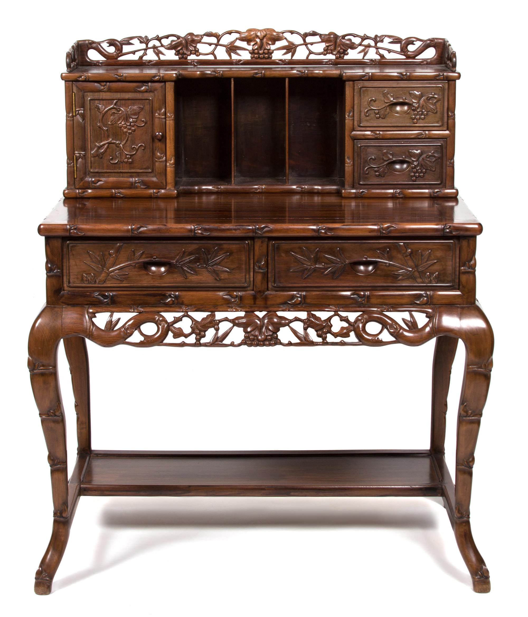 A Chinese Carved Elmwood Writing Desk Height 31 1/4 x width 37 x depth 22 1/2 inches. — 20TH CENTURY