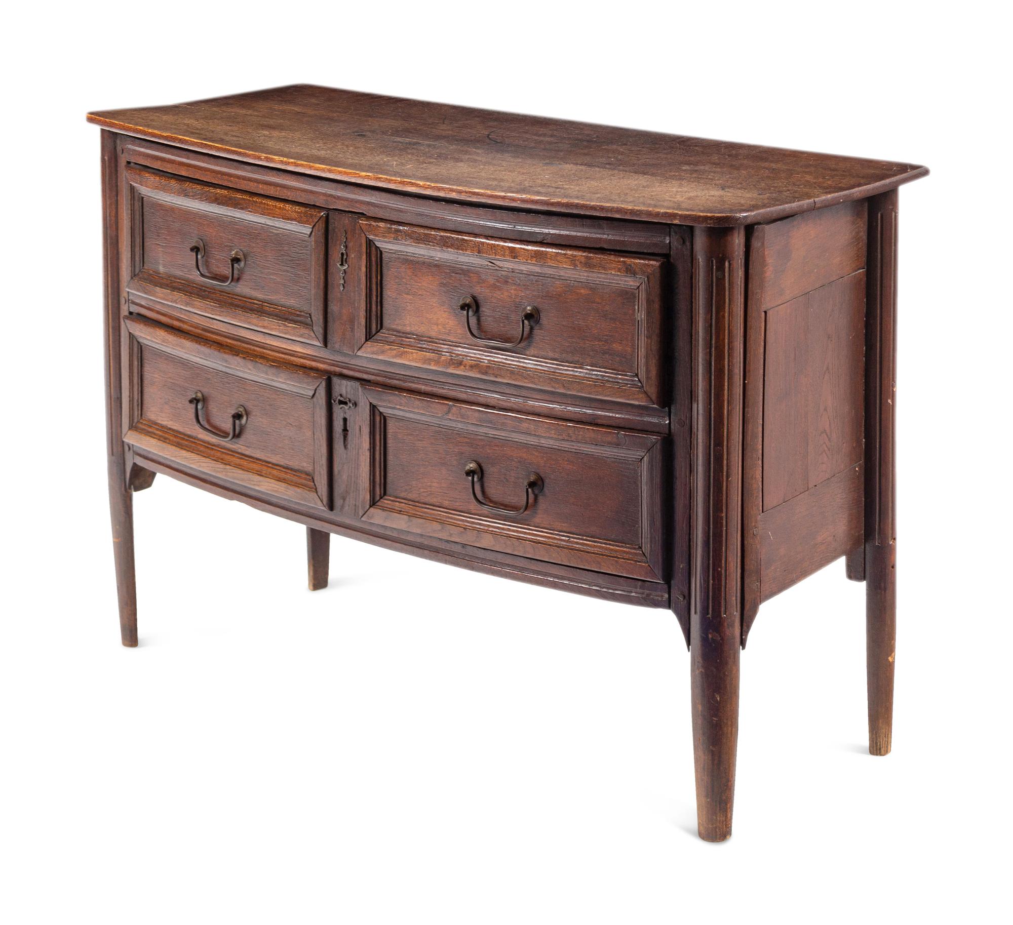 An Italian Oak Bow-Front Chest of Drawers