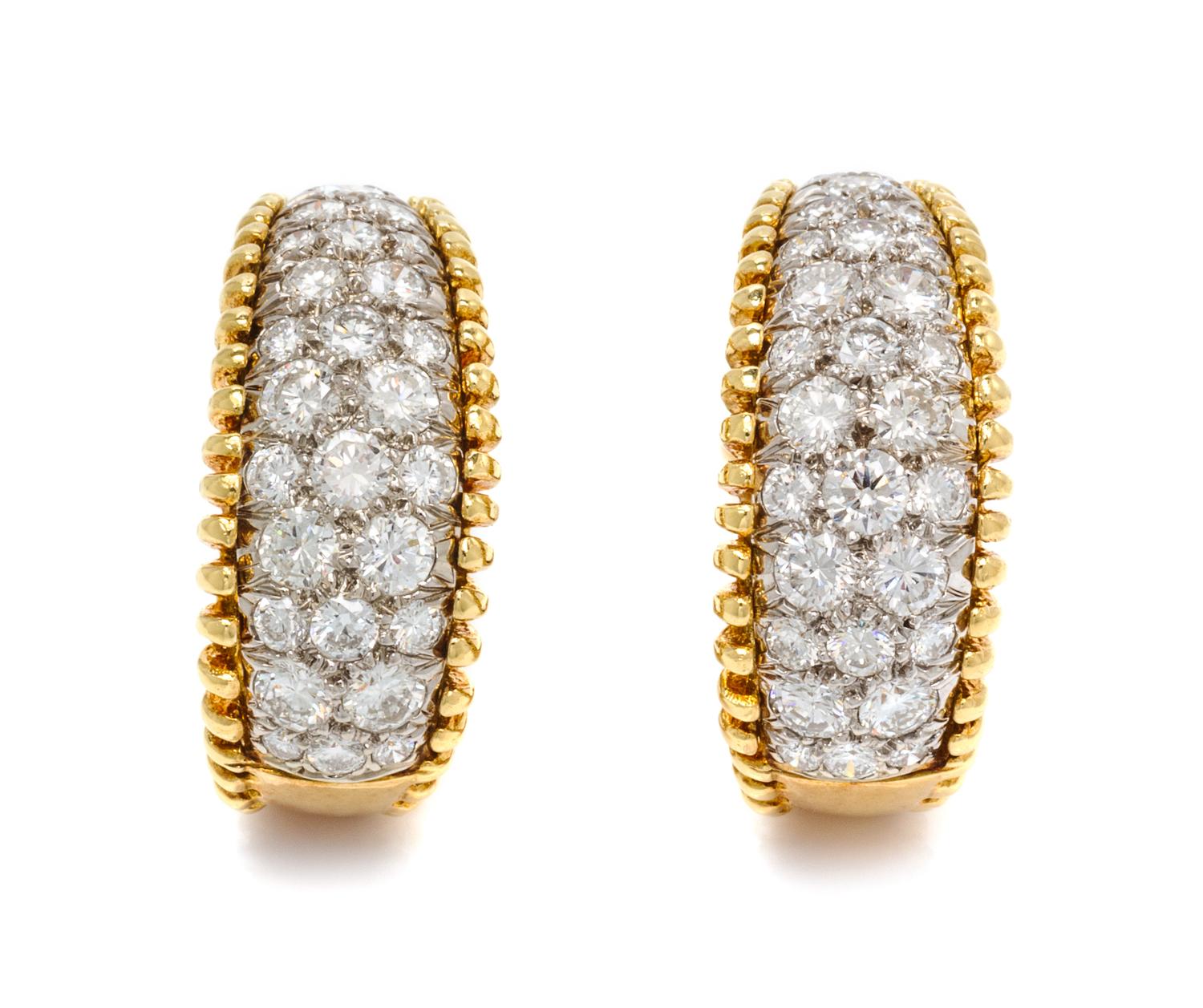 A Pair of 18 Karat Bicolor Gold and Diamond Earclips, 10.10 dwts.