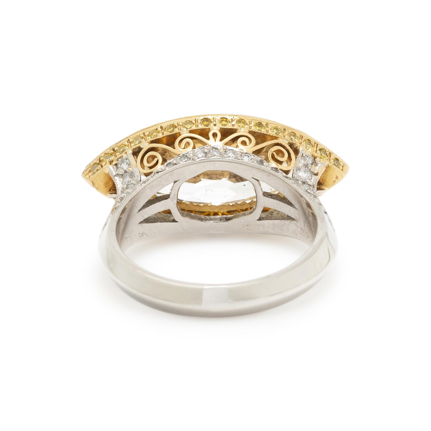 EAST-WEST MARQUISE CUT DIAMOND AND YELLOW DIAMOND RING