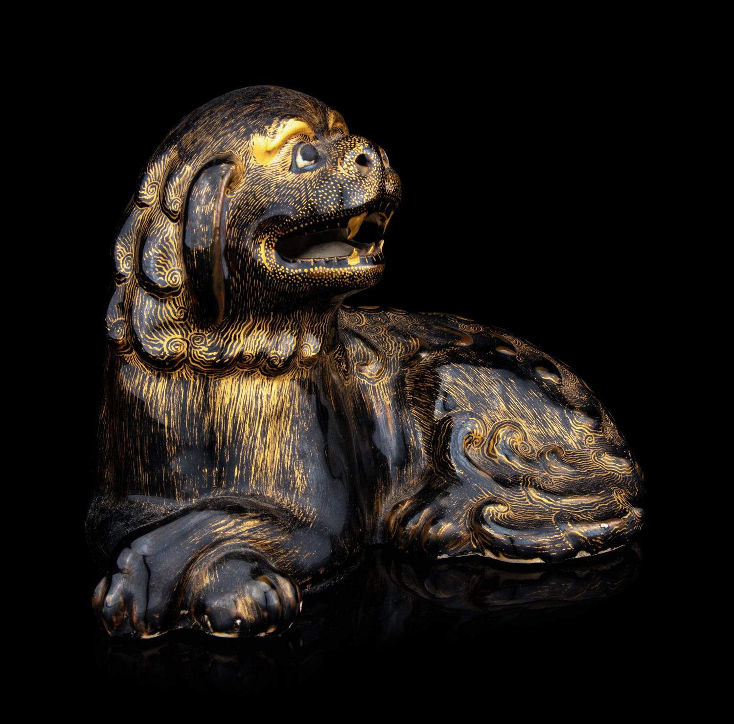 A Chinese Export Gilt Decorated Black Glazed Porcelain Figure of Fu Lion