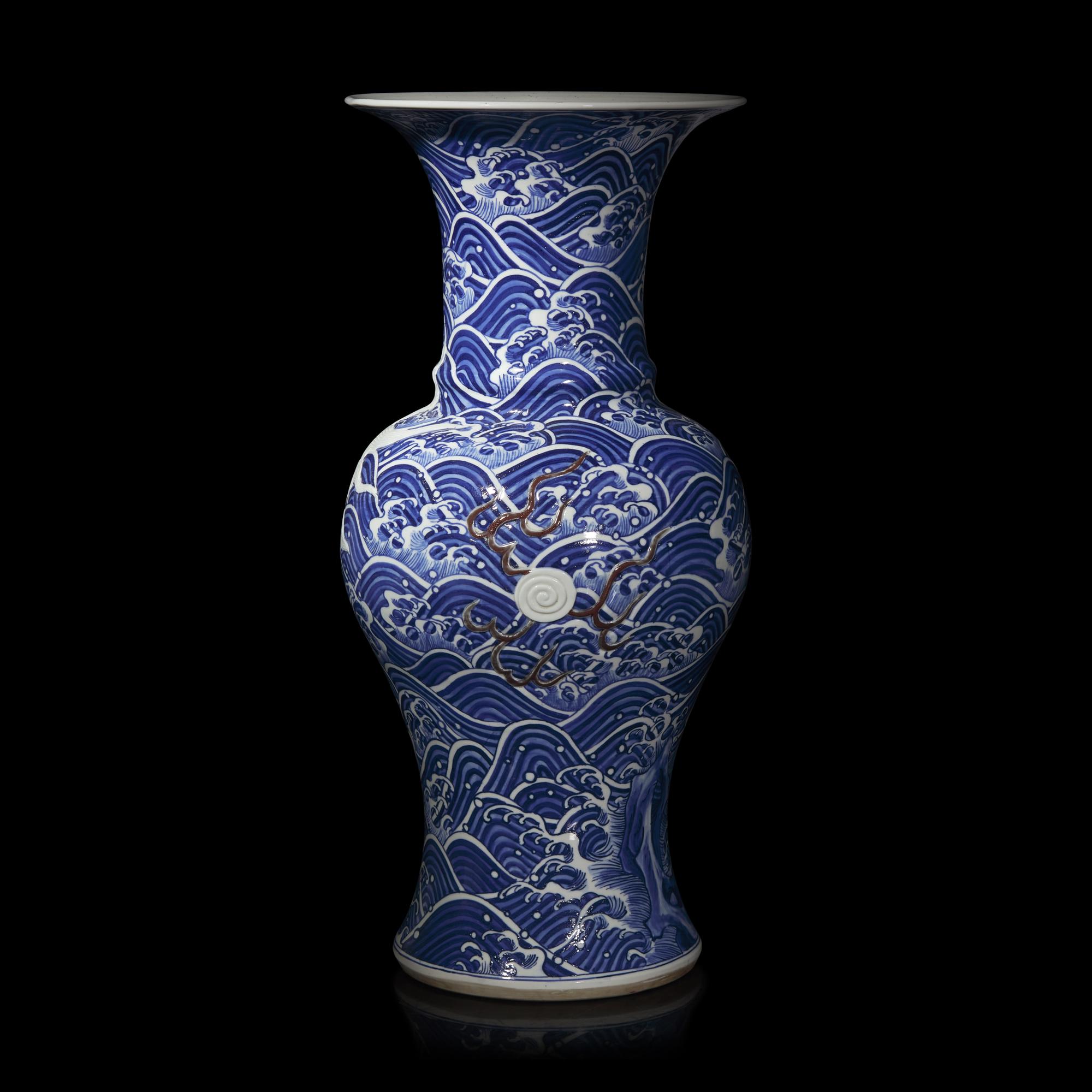 A Large Japanese Carved Blue and White and Red Porcelain 'Kylin on Waves' Vase, Meiji Period 日本明治時期 青花麒麟紋大瓶
