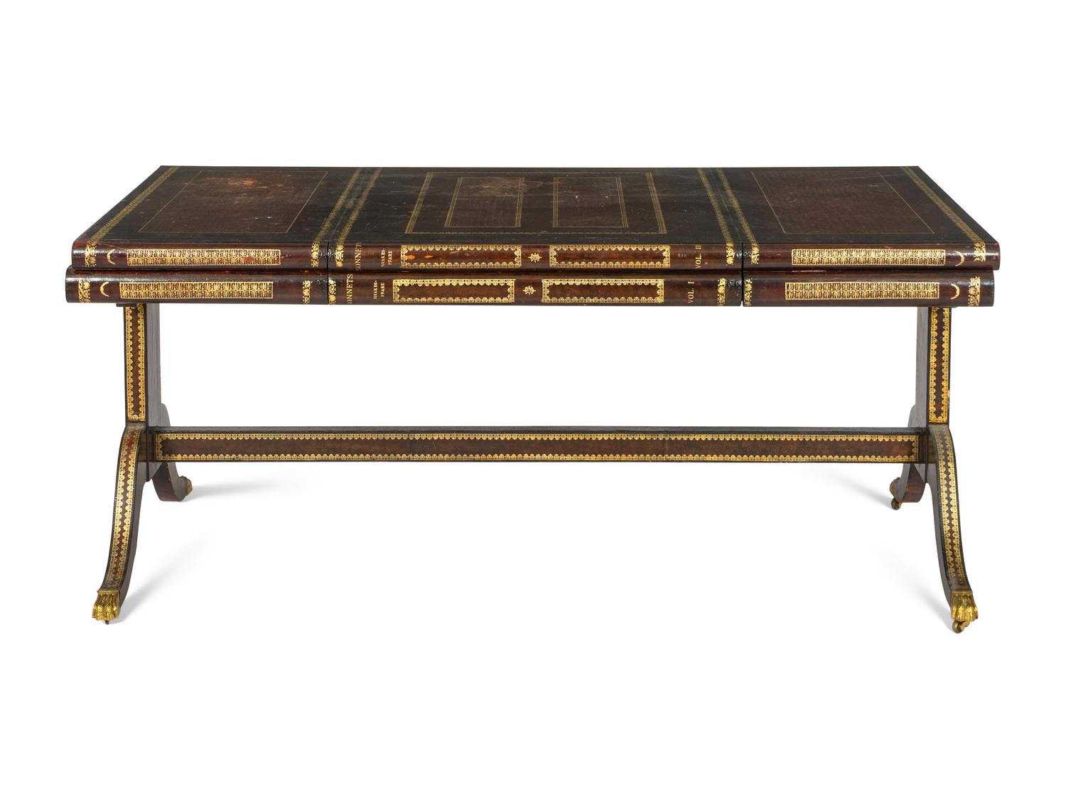 A Maitland-Smith Regency Style Gilt and Embossed Leather Veneered Desk
