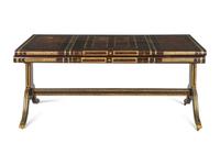 A Maitland-Smith Regency Style Gilt and Embossed Leather Veneered Desk