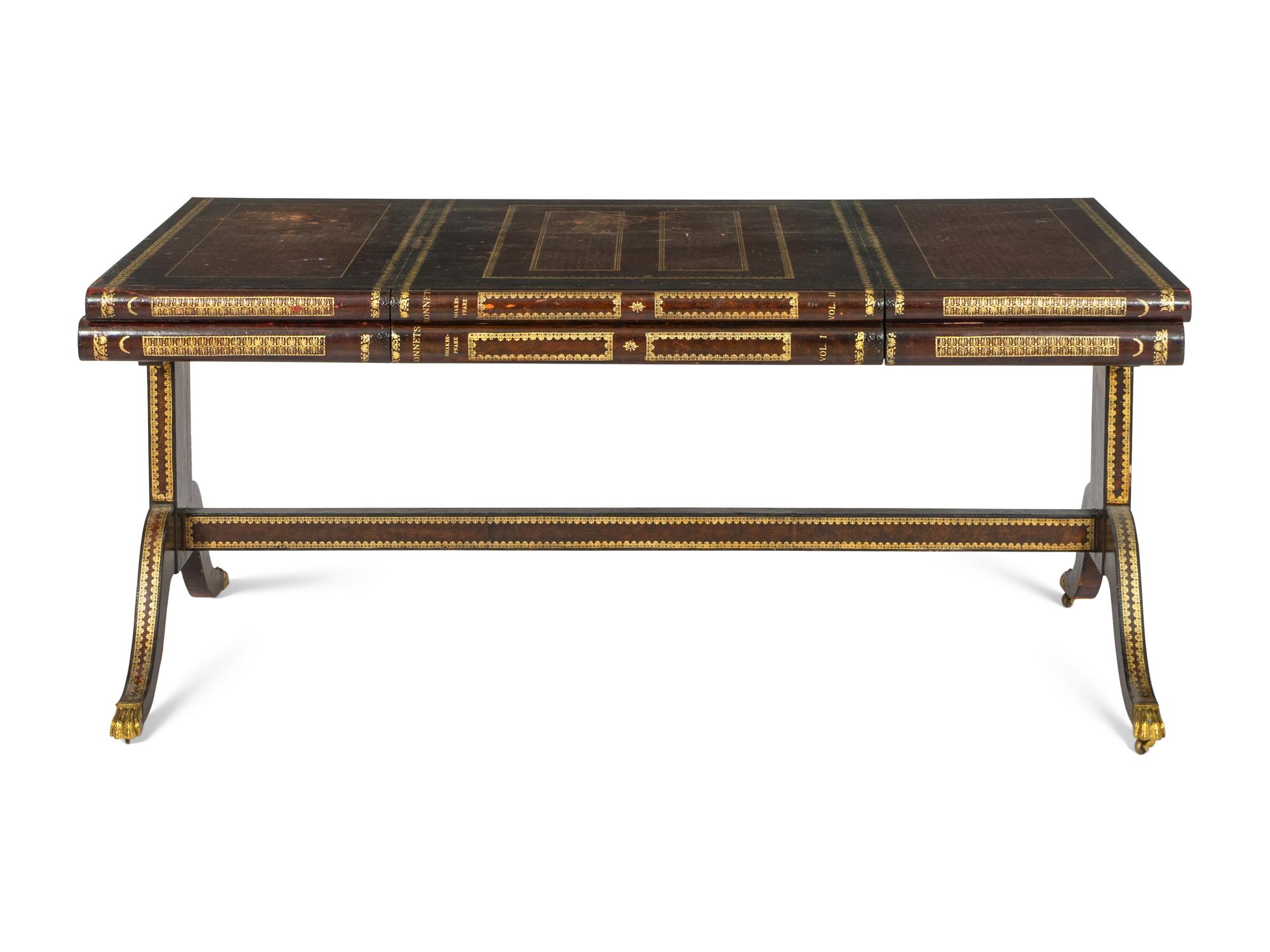 A Maitland-Smith Regency Style Gilt and Embossed Leather Veneered Desk