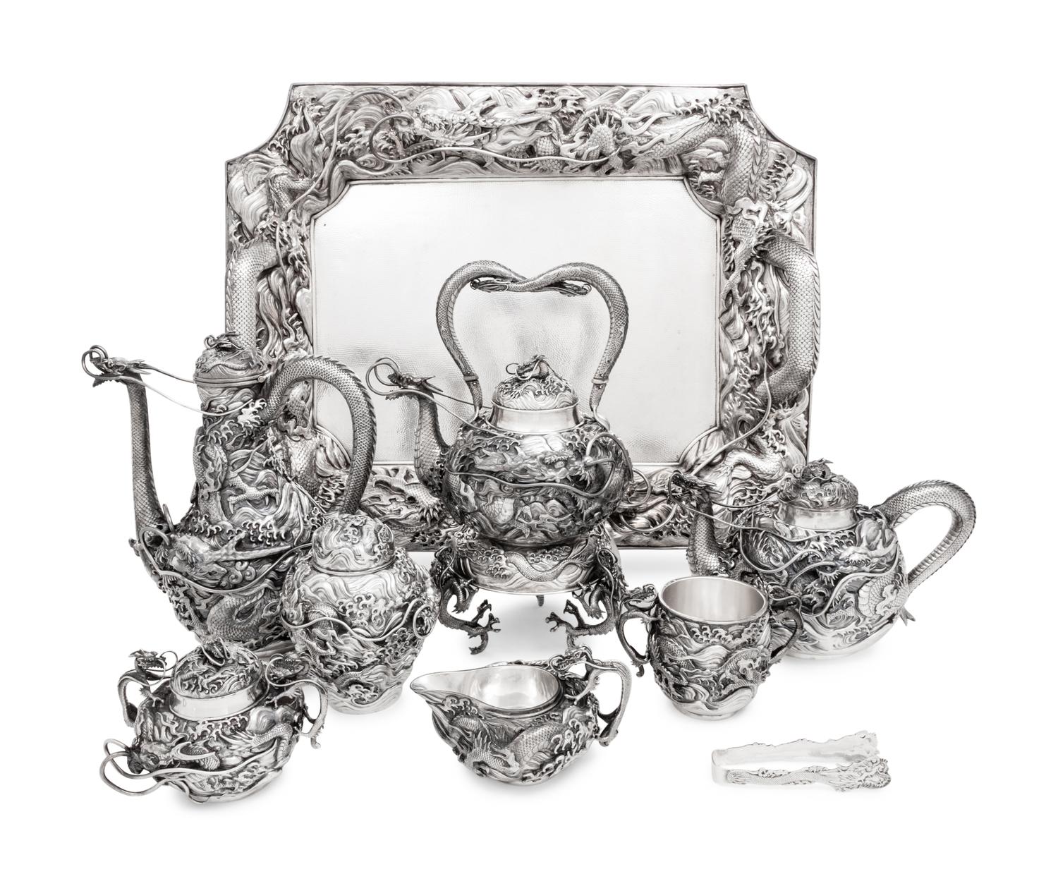An Ornate Japanese Export Silver Eight-Piece Tea and Coffee Service