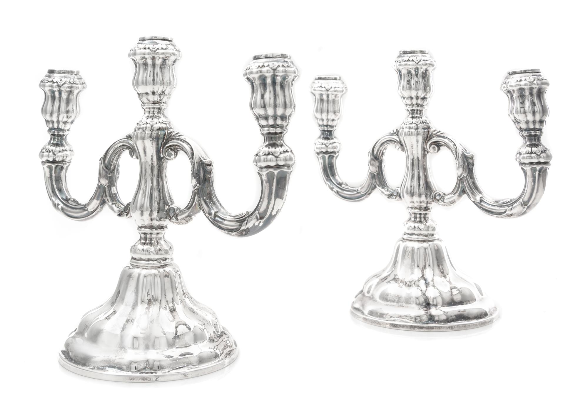 A Pair of German Silver Three-Light Candelabra, Gebruder Deyhle, Schwabisch Gmund, 20th Century, each stem issuing two scrolling candle