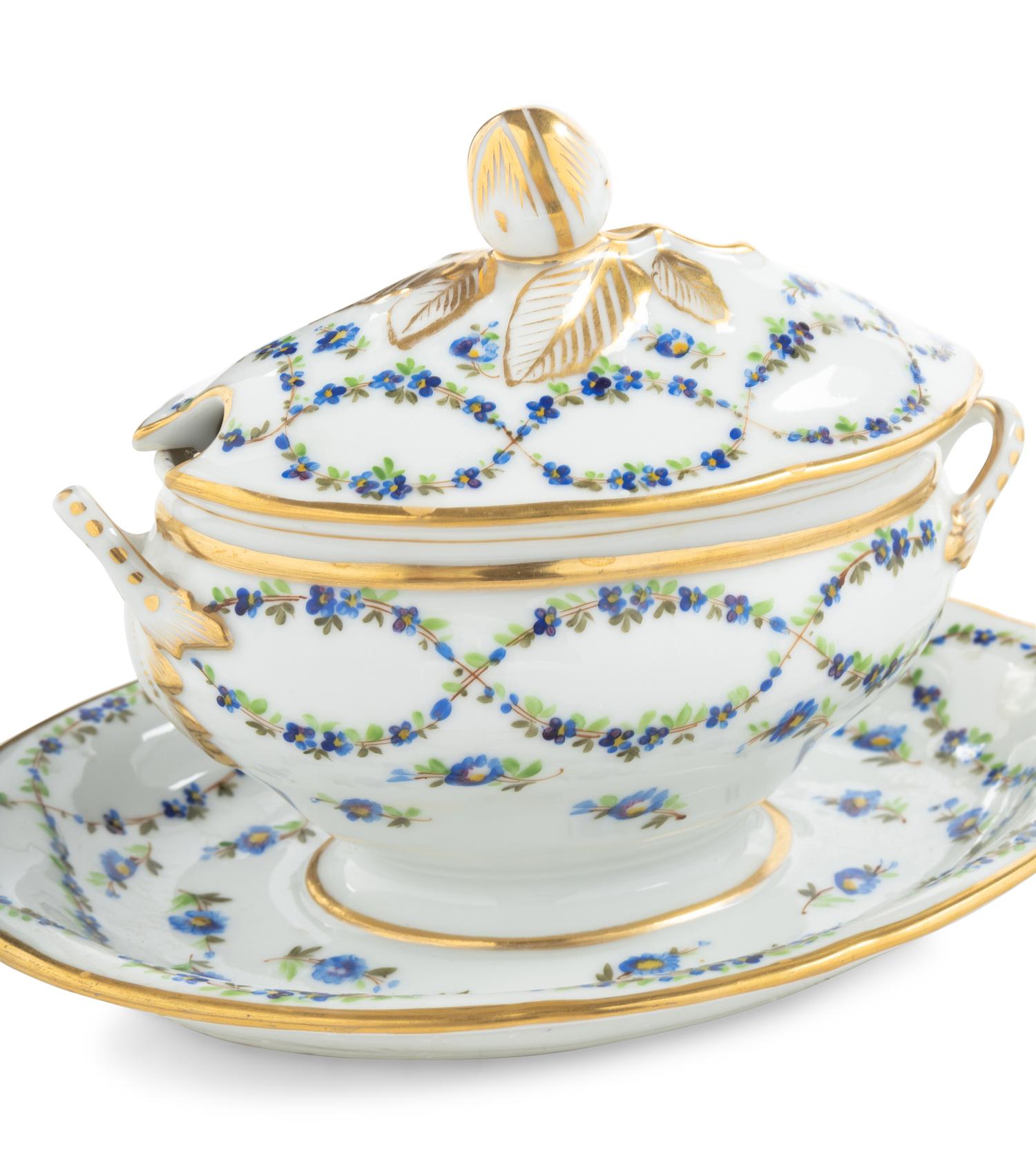 A Pair of English Porcelain Covered Sauce Tureens with Attached Underplates