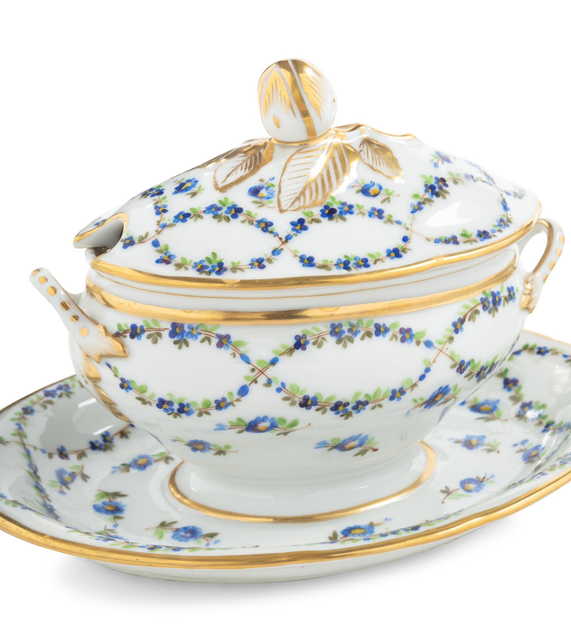 A Pair of English Porcelain Covered Sauce Tureens with Attached Underplates
