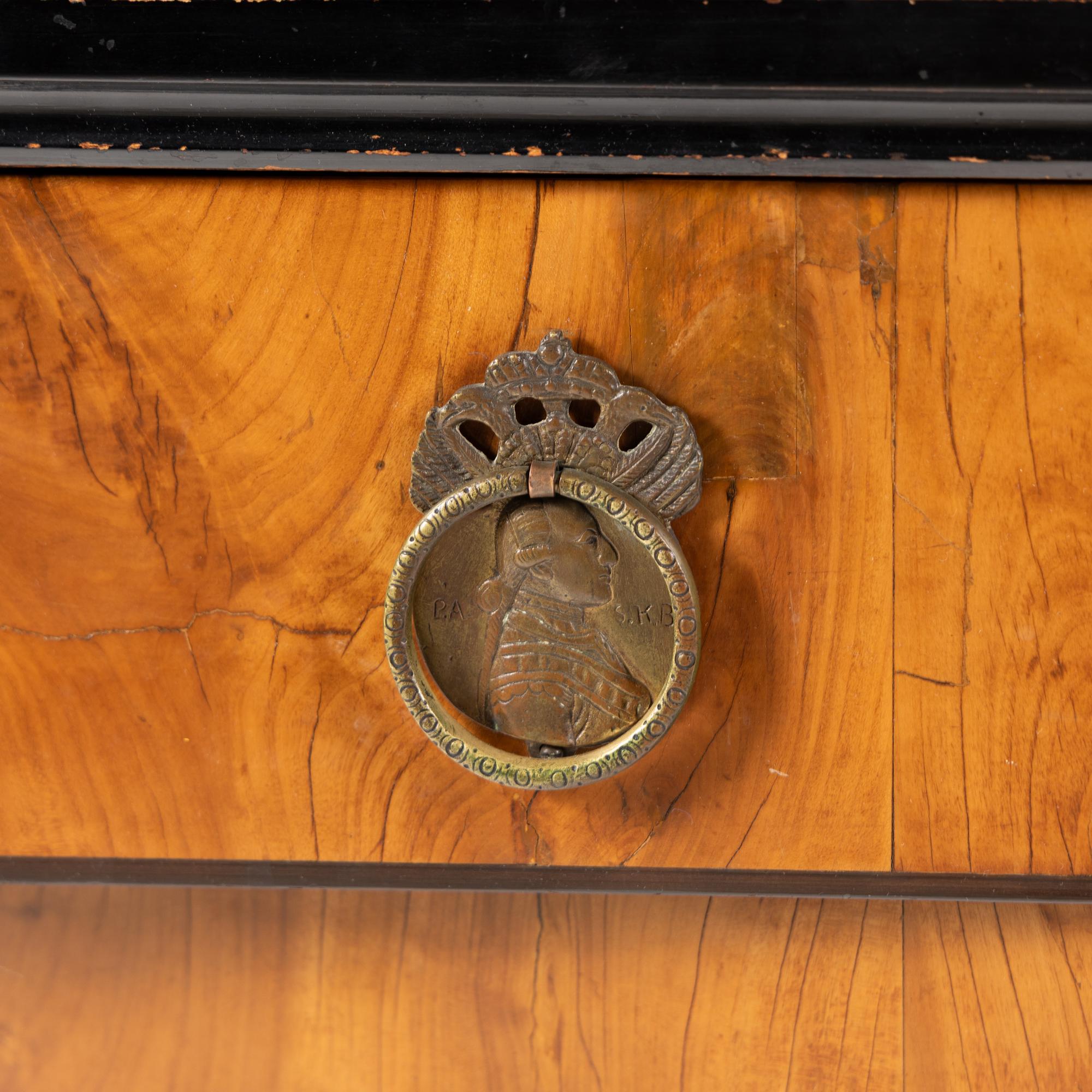 A Biedermeier Part-Ebonized Pearwood Commode