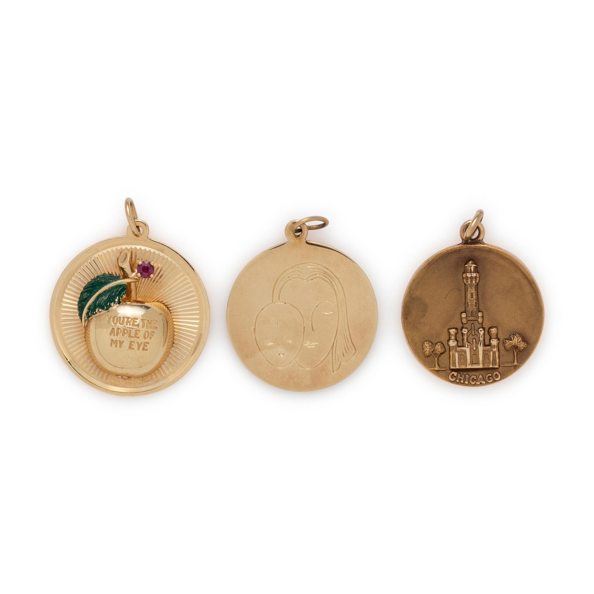COLLECTION OF YELLOW GOLD CHARMS
