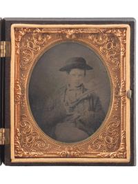[EARLY PHOTOGRAPHY]. Sixth plate tintype of young boy armed with Model 1860 Colt Army revolver.