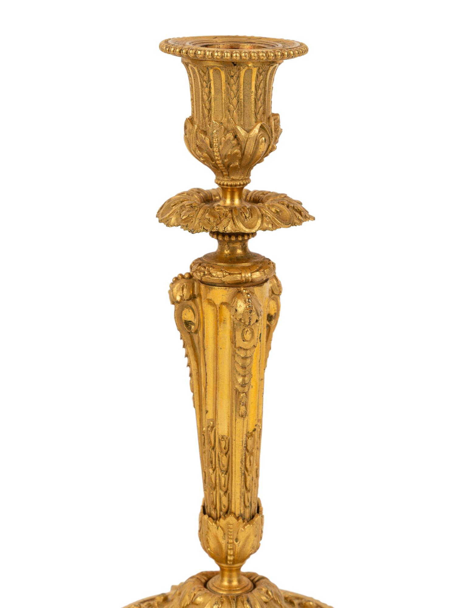 A Pair of Continental Gilt Bronze Candlesticks