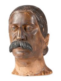 A Carved and Painted Wood Head of a Mustachioed Man