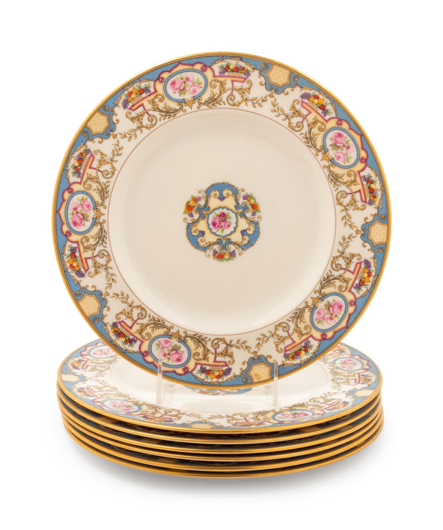 A Set of Seven Morgan Belleek Plates