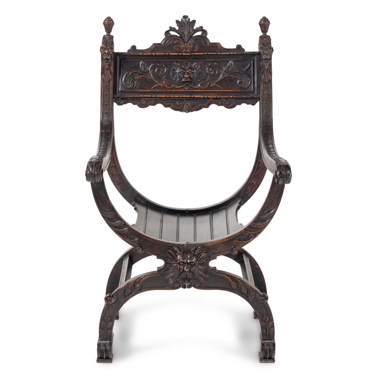 An Italian Renaissance Revival Carved Walnut Savonarola Chair