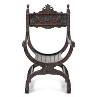 An Italian Renaissance Revival Carved Walnut Savonarola Chair