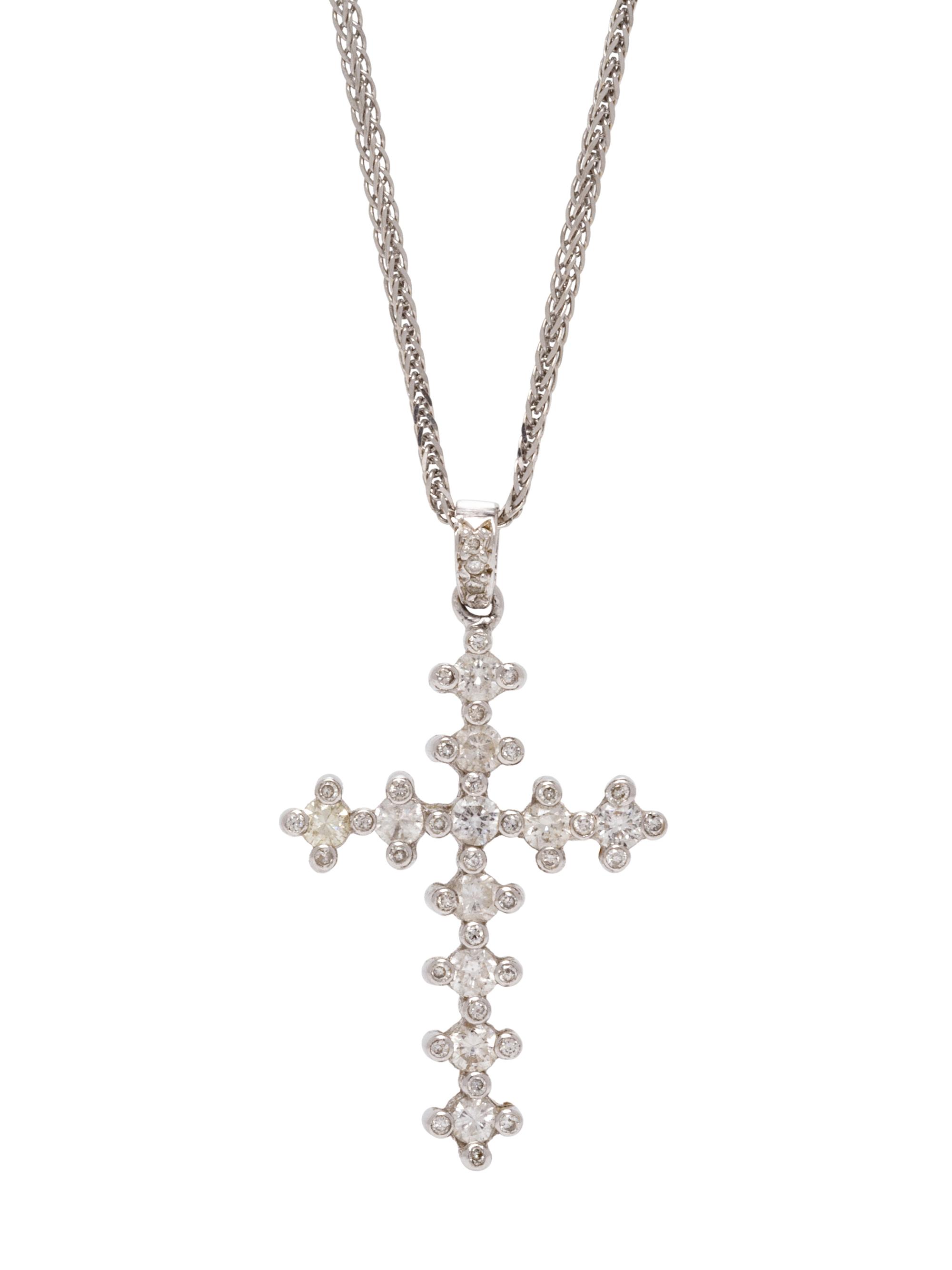 A 14 Karat White Gold and Diamond Cross Pendant/Necklace,