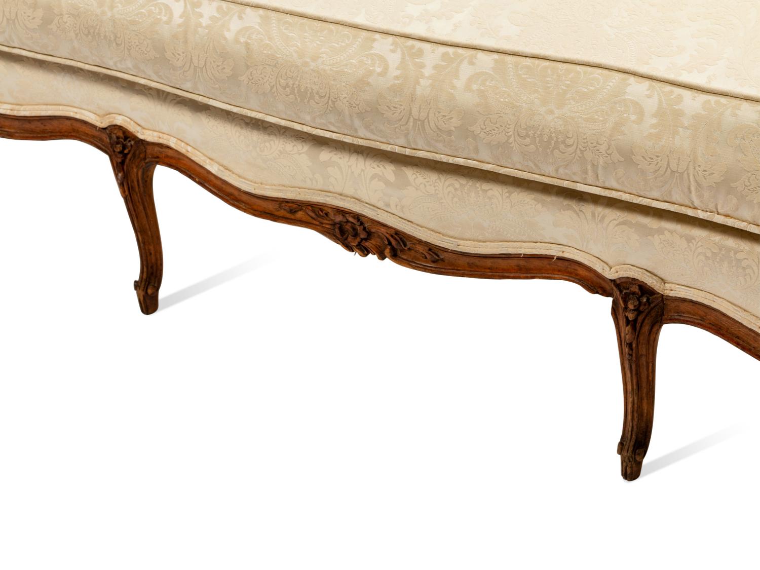 An Italian Carved Walnut Sofa in the Louis XV Taste