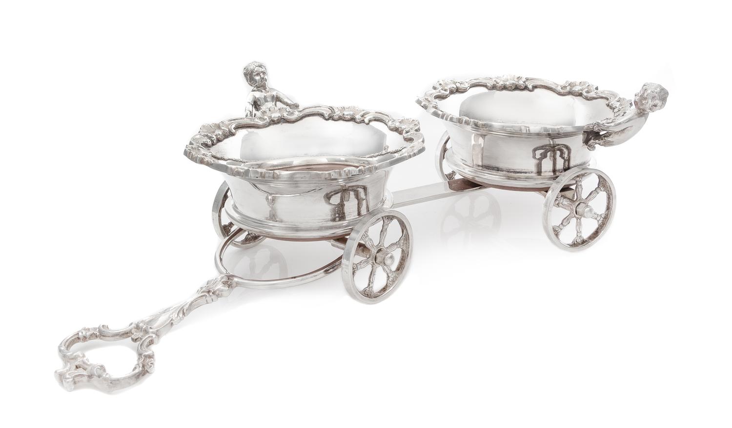 A Silver-Plate Wine Trolley, Likely English, Early 20th Century, the twin coasters with rims worked to show rocaille, foliate scrolls a