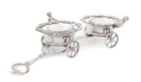 A Silver-Plate Wine Trolley, Likely English, Early 20th Century, the twin coasters with rims worked to show rocaille, foliate scrolls a