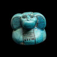An Egyptian Blue Faience Canopic Jar Lid with the Head of a Baboon (Hapi)