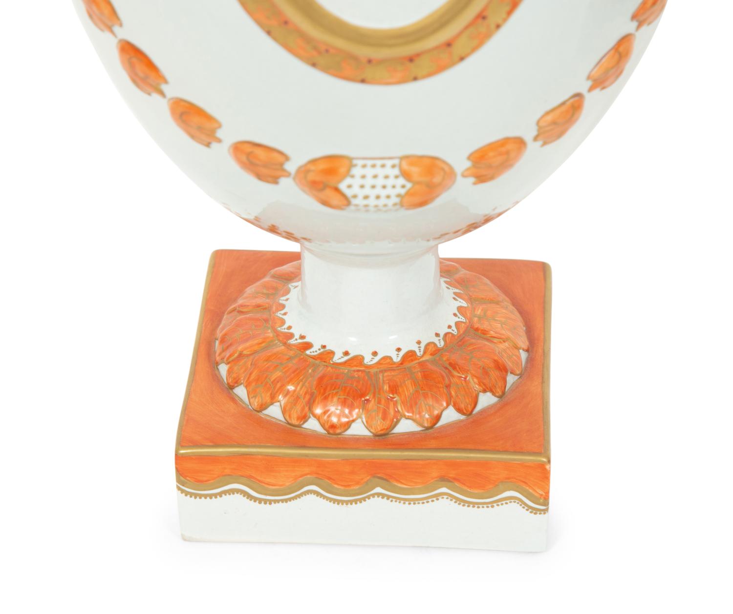 A Pair of Neoclassical Style Porcelain Urns with Bell Flower Swags