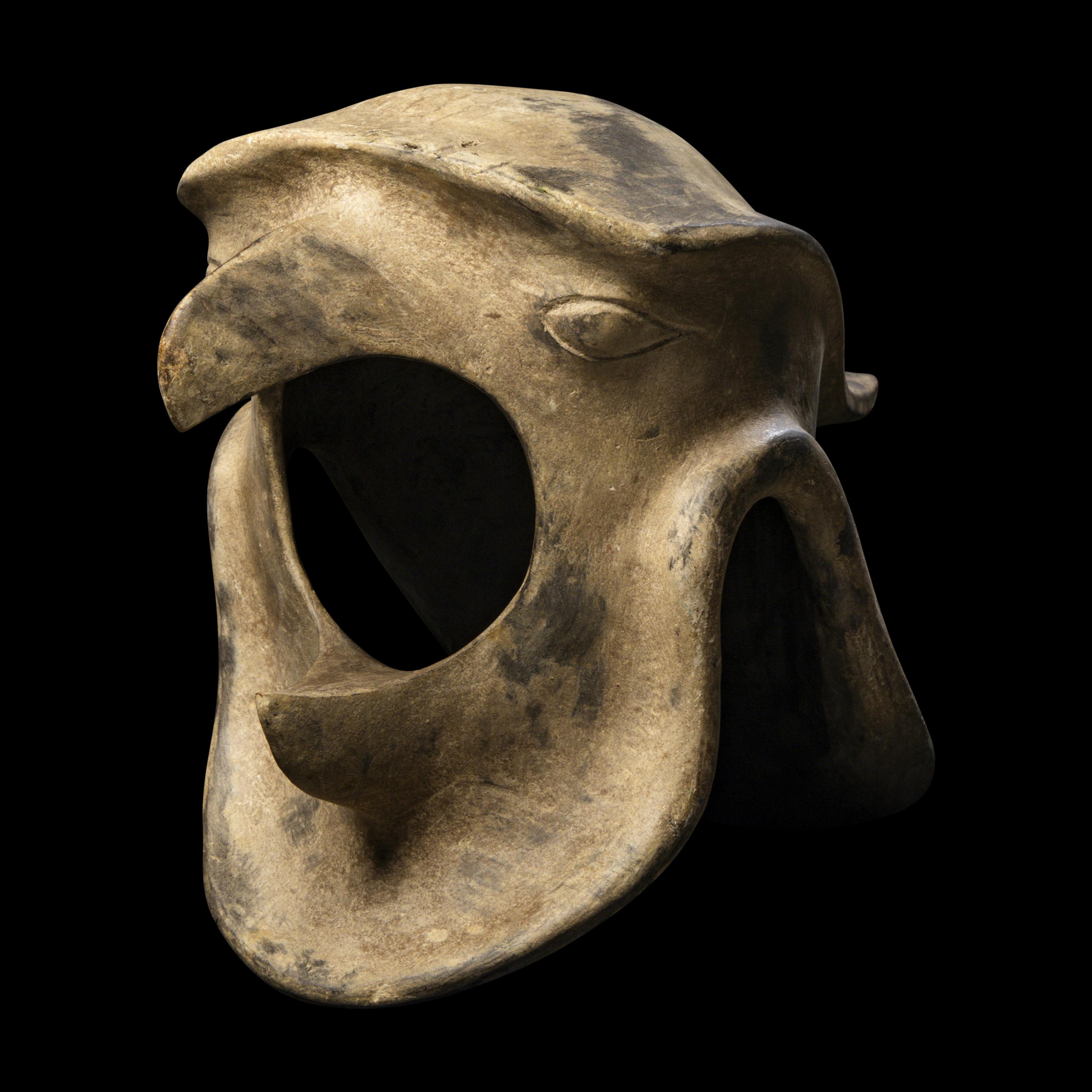 An Aztec Carved Wood Helmet of the Eagle Warrior