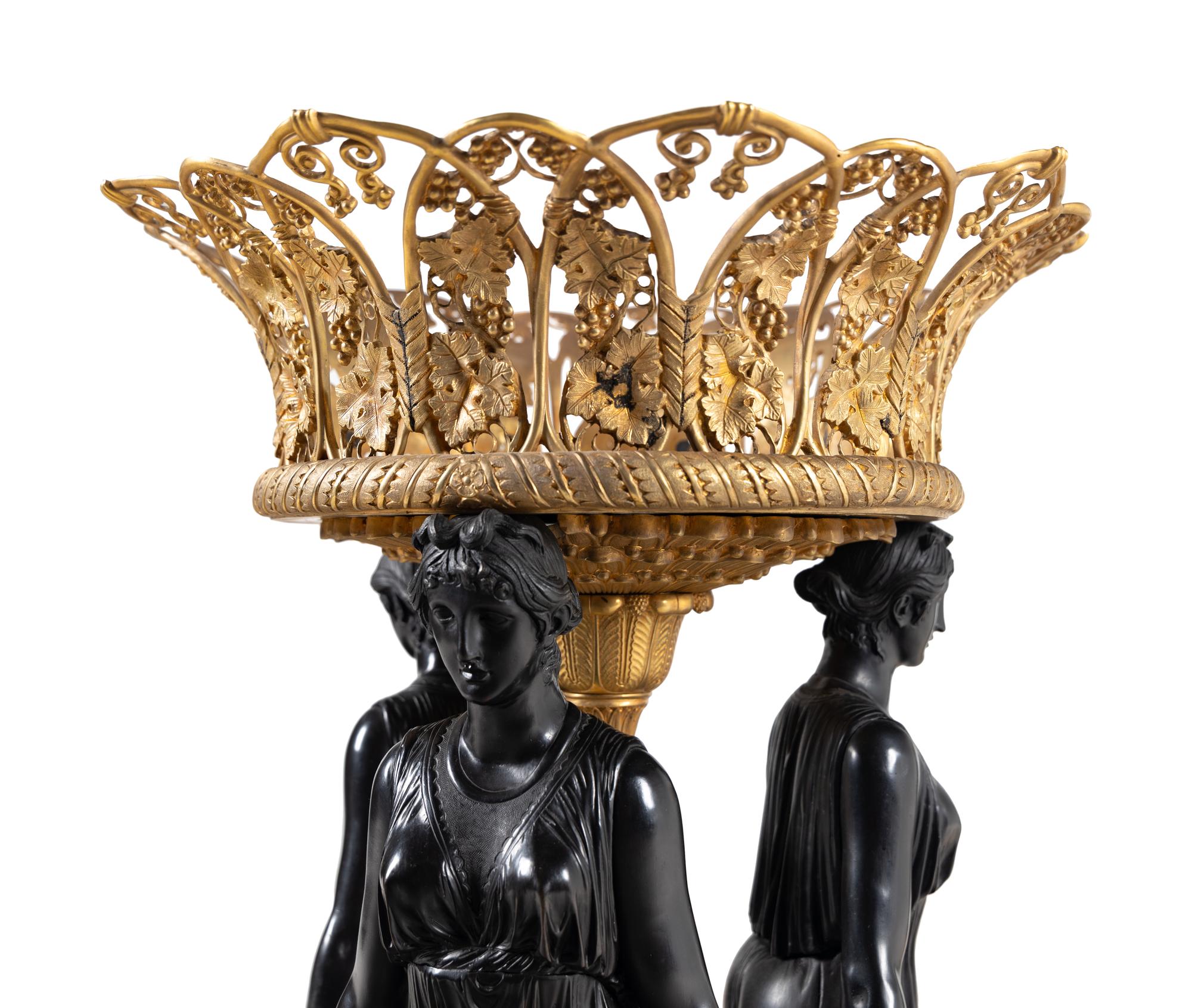 A Pair of Empire Style Gilt and Patinated Bronze Figural Centerpieces