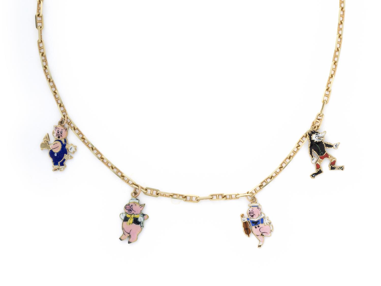 YELLOW GOLD AND ENAMEL 'THREE LITTLE PIGS' CHARM NECKLACE