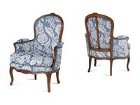 A Pair of Louis XV Walnut Bergères