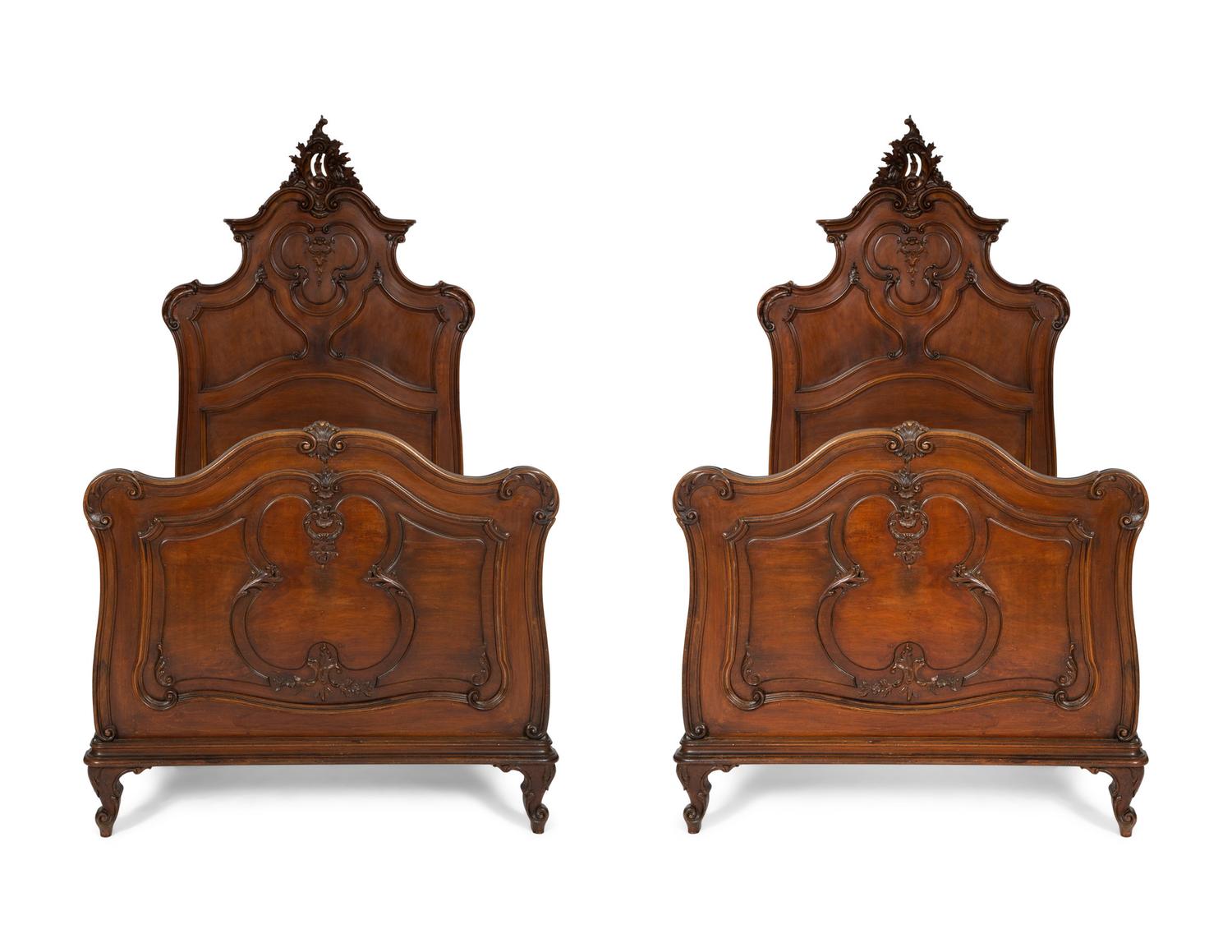 A Pair of American Victorian Carved Mahogany Twin Beds