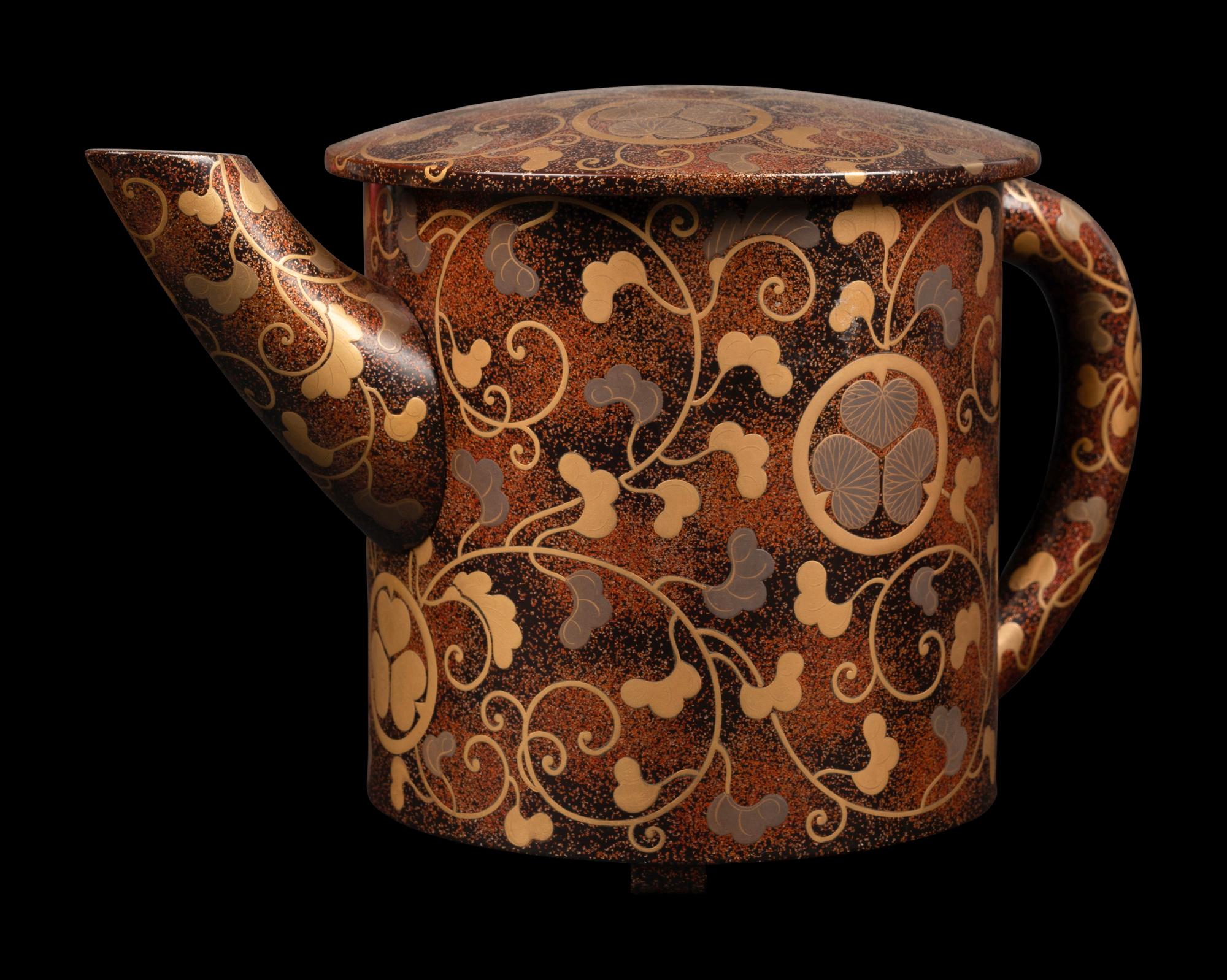 A Japanese Gold Decorated Brown and Red Lacquer Tableware Set