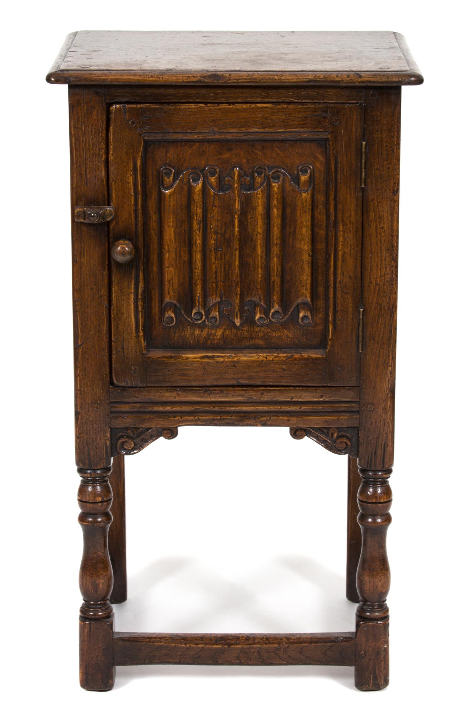 A Jacobean Style Oak Side Cabinet — 20TH CENTURY