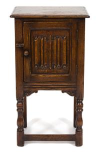 A Jacobean Style Oak Side Cabinet — 20TH CENTURY