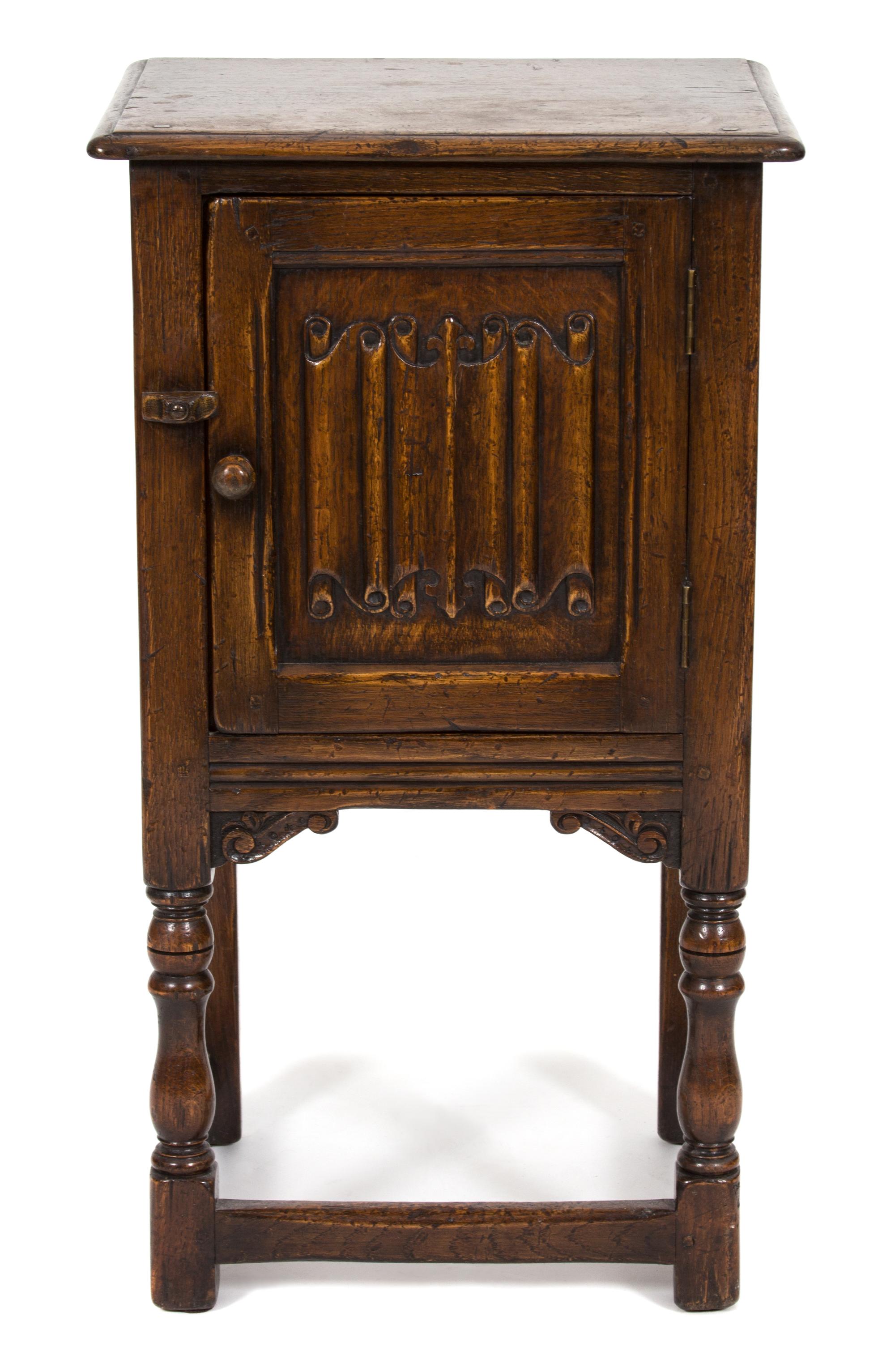 A Jacobean Style Oak Side Cabinet — 20TH CENTURY