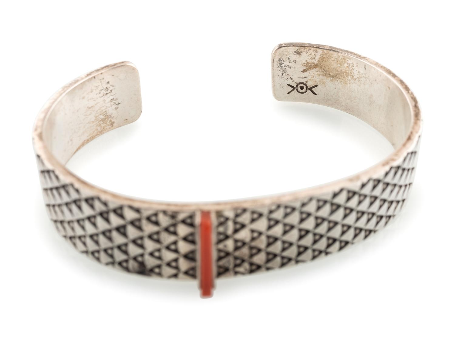 Heavily Stamped Silver Cuff Bracelet, set with a Slender Coral Sliver