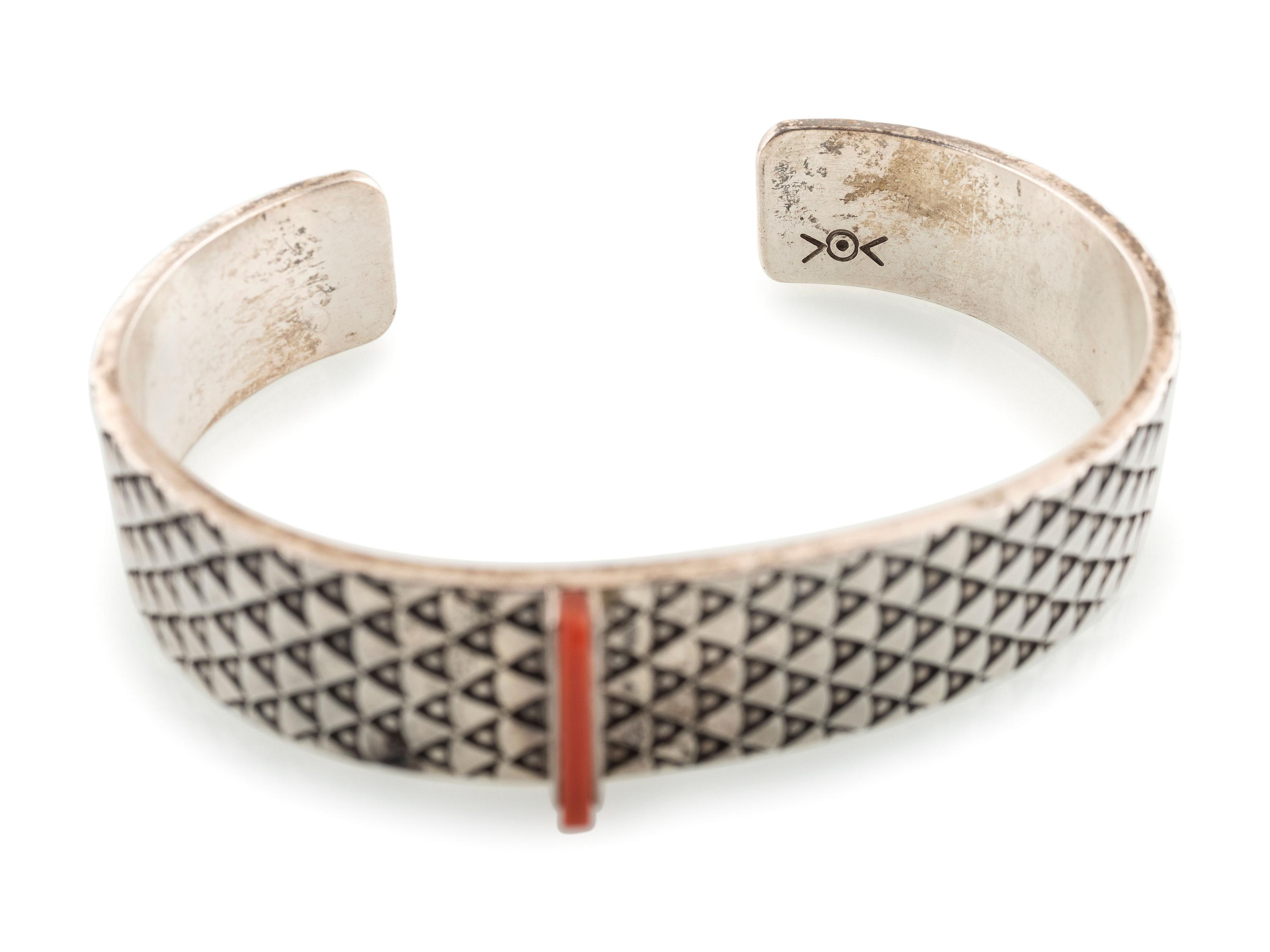 Heavily Stamped Silver Cuff Bracelet, set with a Slender Coral Sliver