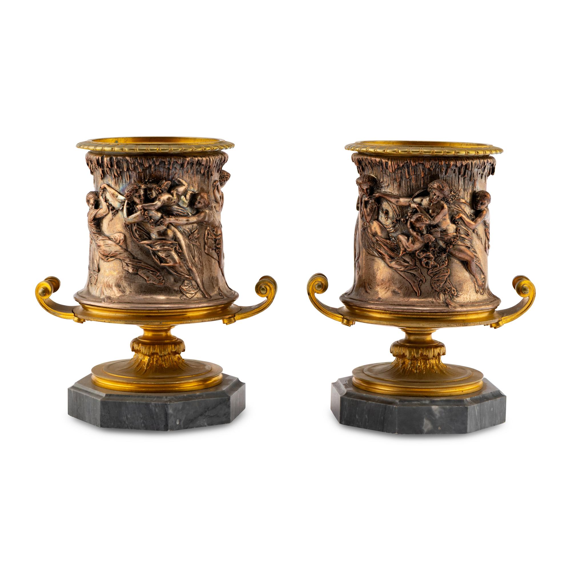 A Pair of French Gilt and Silvered Bronze Urns