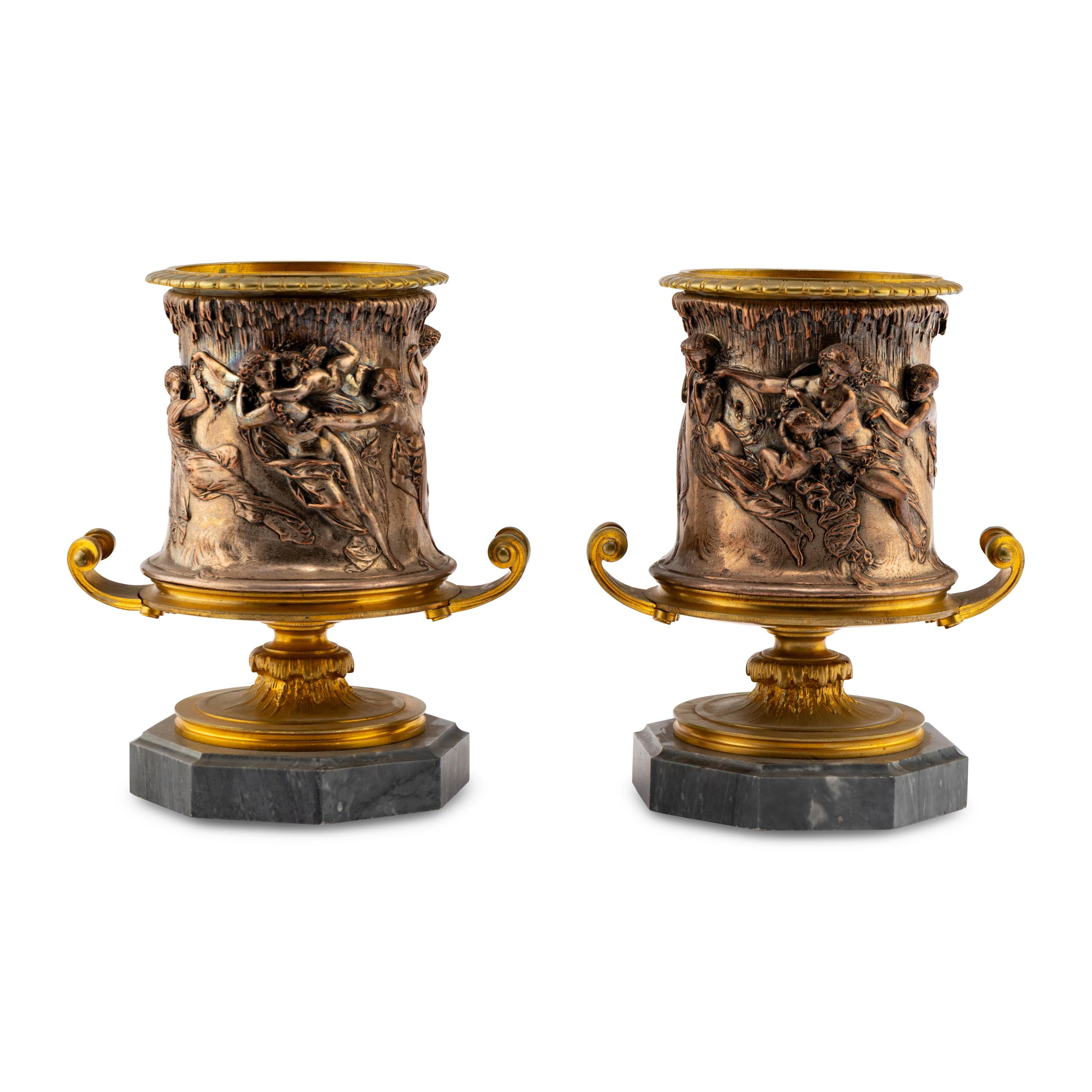 A Pair of French Gilt and Silvered Bronze Urns