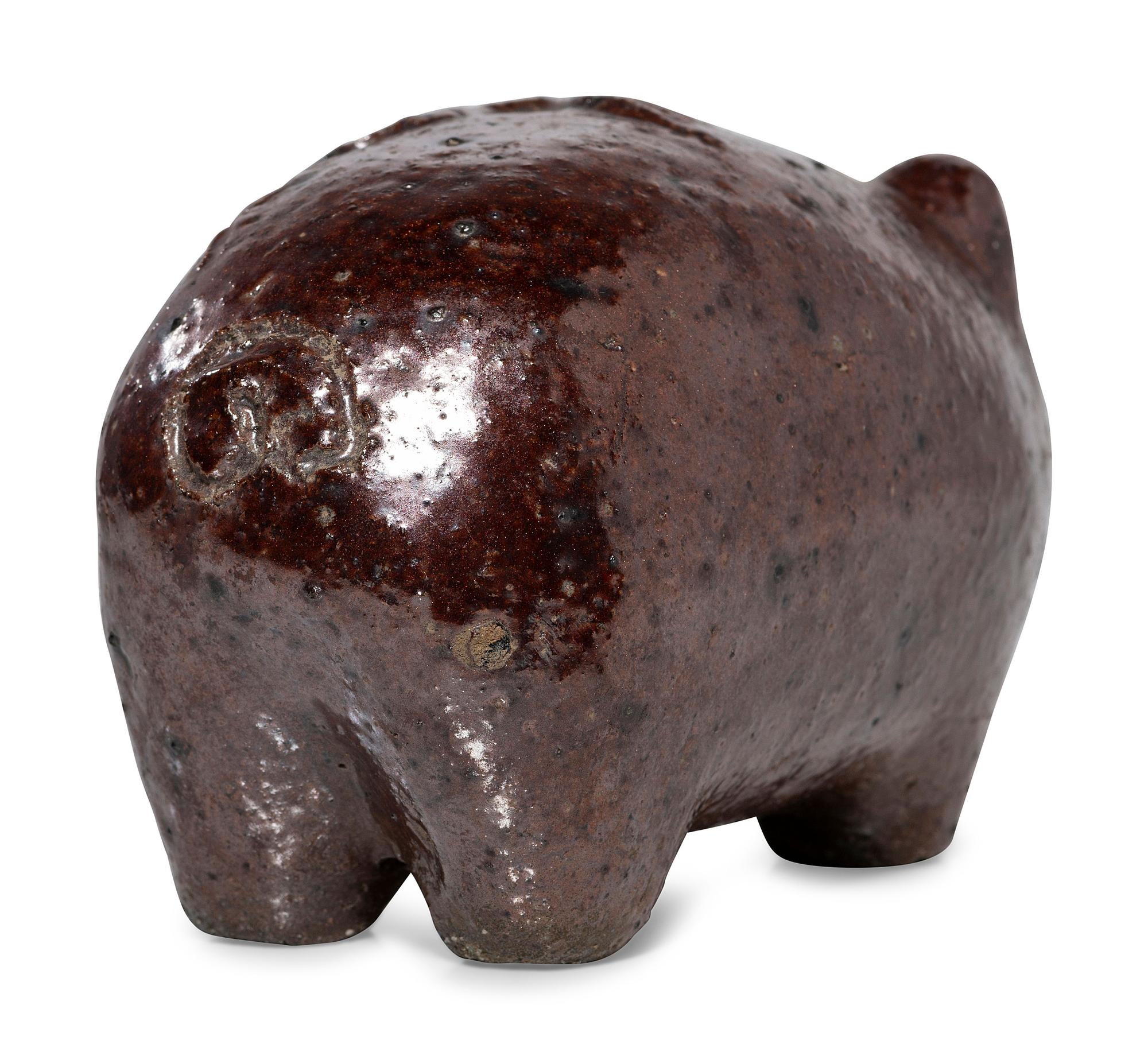 An Ohio Brown-Glazed Sewer Tile Pig