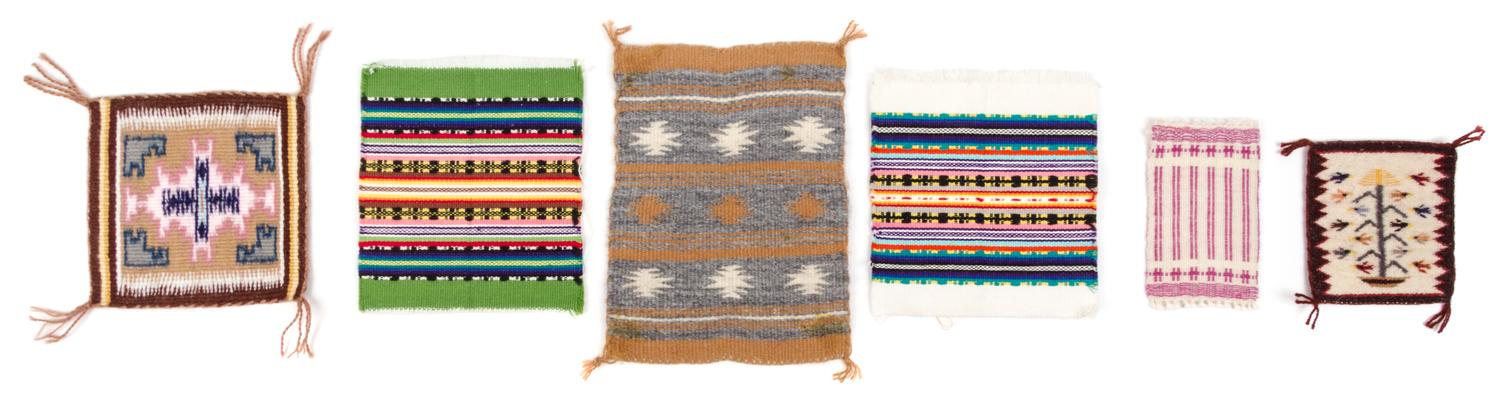 A Group of Nine Rugs Largest 14 x 9 inches.