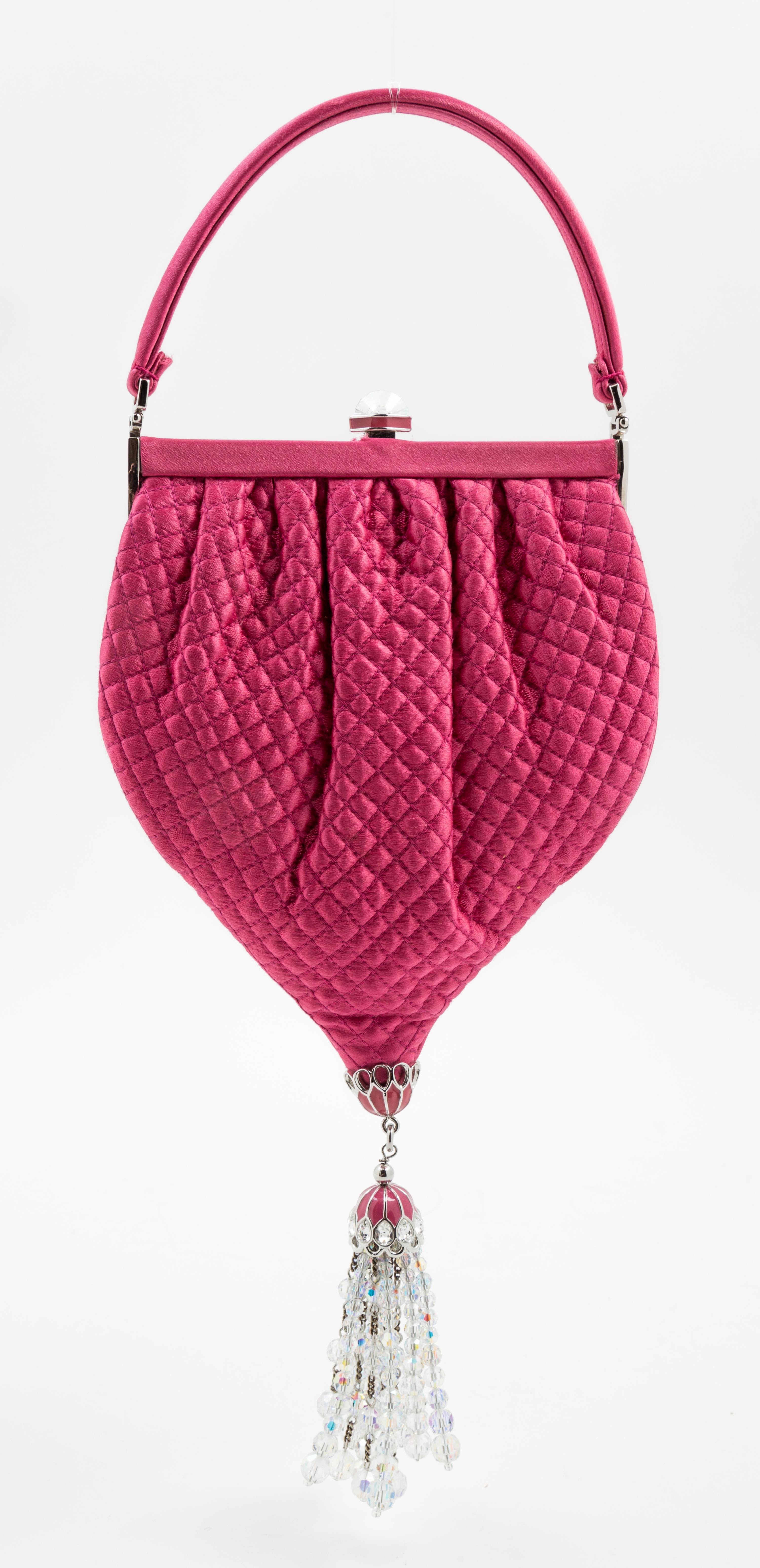 A Judith Leiber Pink Satin Quilted Handbag, 5.5" x 10" x 1"; Handle drop: 3".