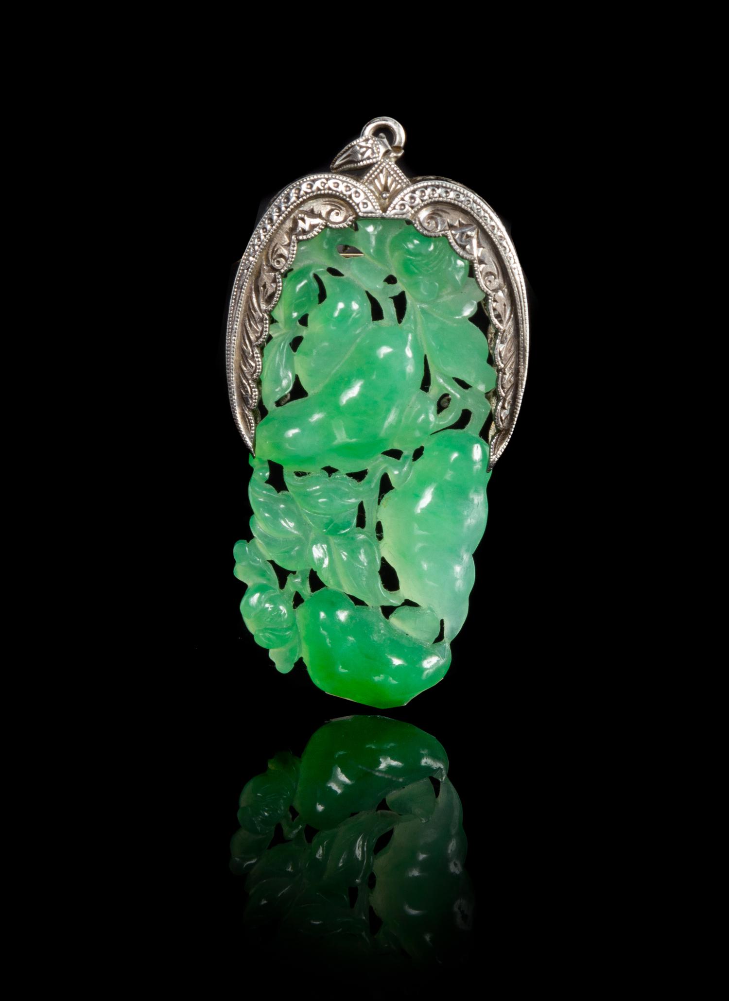 An Apple Green And Celadon Jadeite Pendant Length 1 3/4 inches.