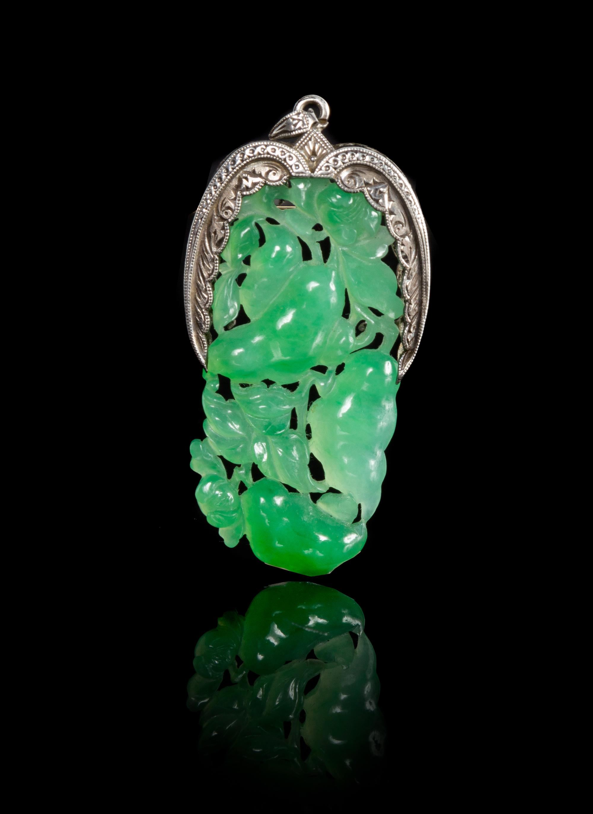 An Apple Green And Celadon Jadeite Pendant Length 1 3/4 inches.