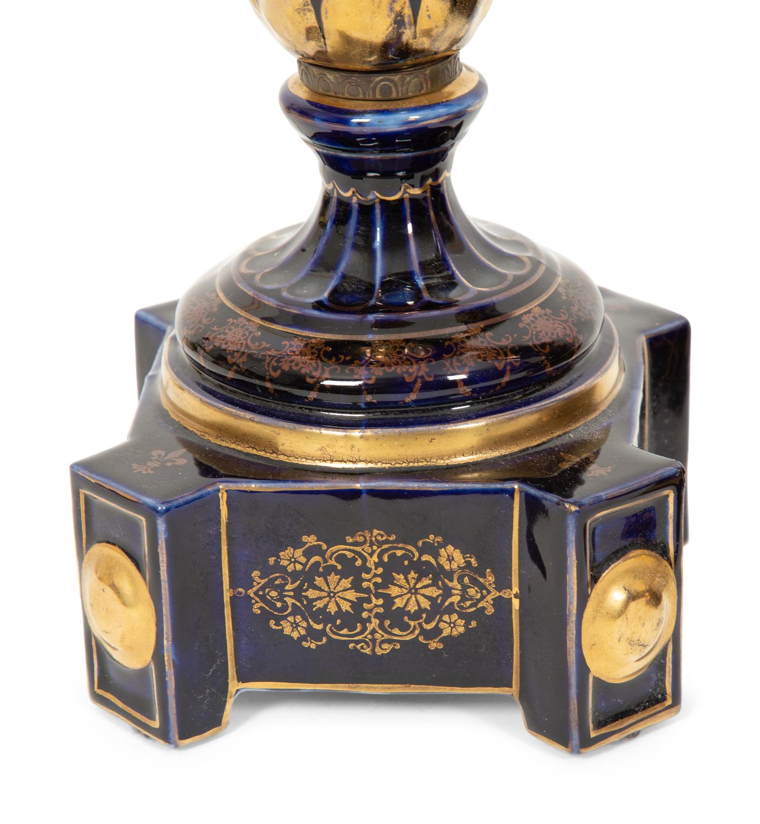 A Pair of Sèvres Style Porcelain Urns Mounted as Lamps